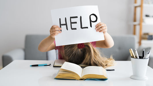 Young girl overwhelmed with schoolwork, showing signs of ADHD and struggling with focus and attention