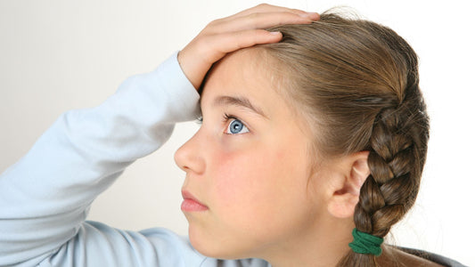 Young girl with ADHD looking distracted, representing working memory struggles and forgetfulness.